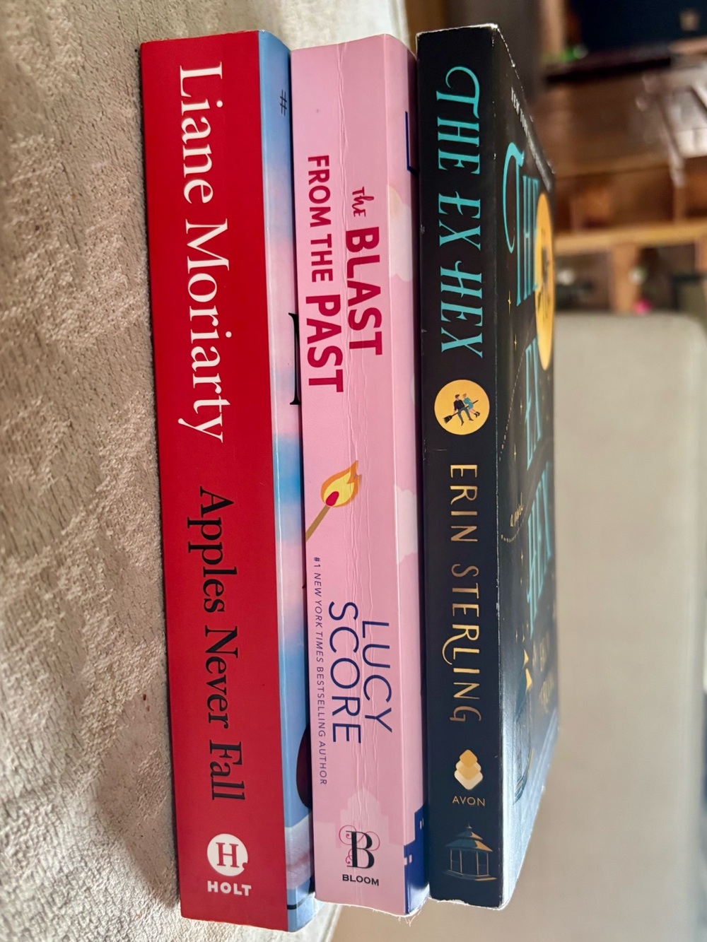 Trifecta of Books by Erin Sterling, Liane Moriarty, and Lucy Score.